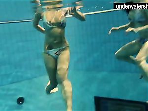 2 marvelous amateurs showing their bodies off under water